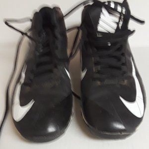 Nike Alpha black football cleats with white swoosh